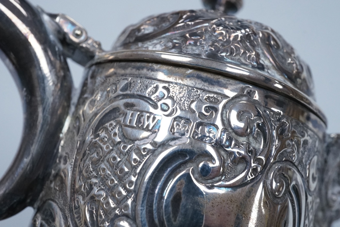 A late Victorian silver mounted cut glass claret jug, by Henry Wigfull, Sheffield, 1897, with mask spout and decorated with foliage and scrolls, height 27.5cm.